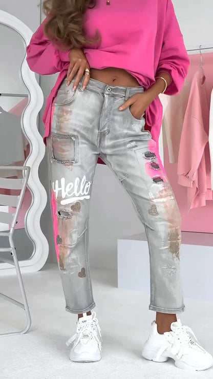 Ravelle damesjeans met ripped details en graffiti-streetstyle