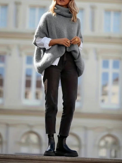 Gebreide poncho-top met polokraag en korte mouwen, losse pasvorm