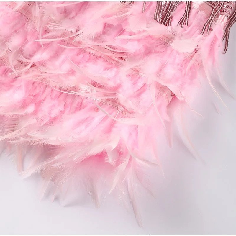 SterrenGlam Pailletten Cocktailjurk Met Veren En Glamourlook