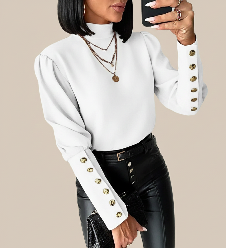 Lunara dames top met gouden knoopdetails en hoge hals